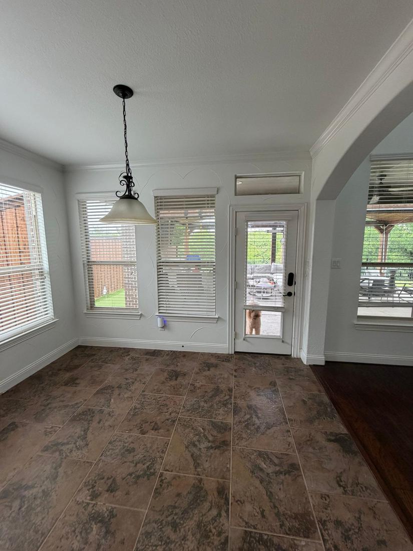 Breakfast nook with standard back door before bifold install