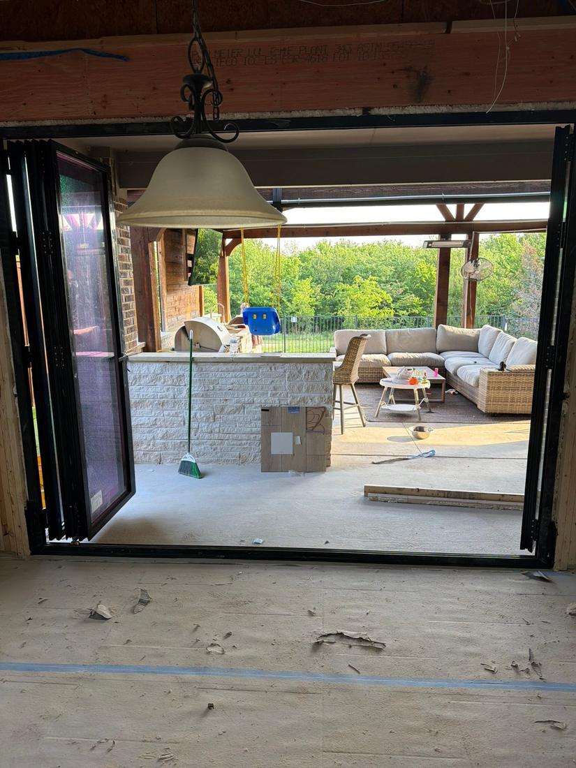Bifold door folded open to covered patio