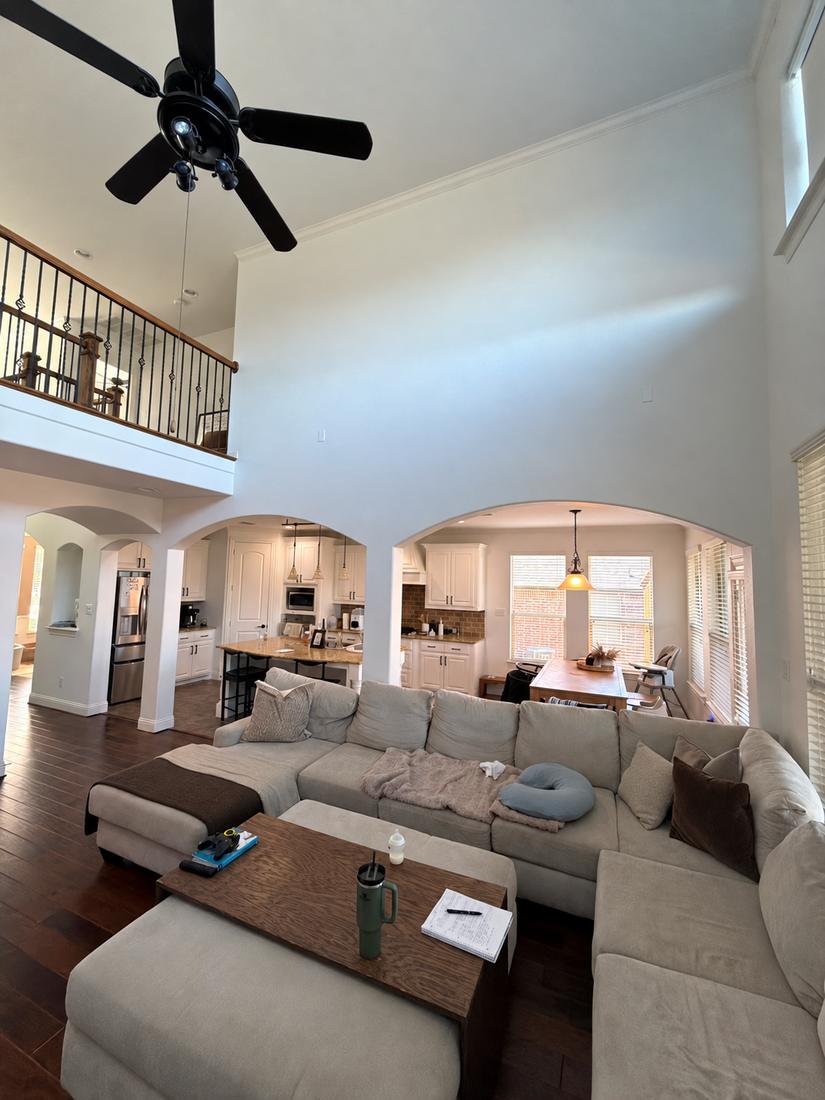 Living room with arched openings before wall removal