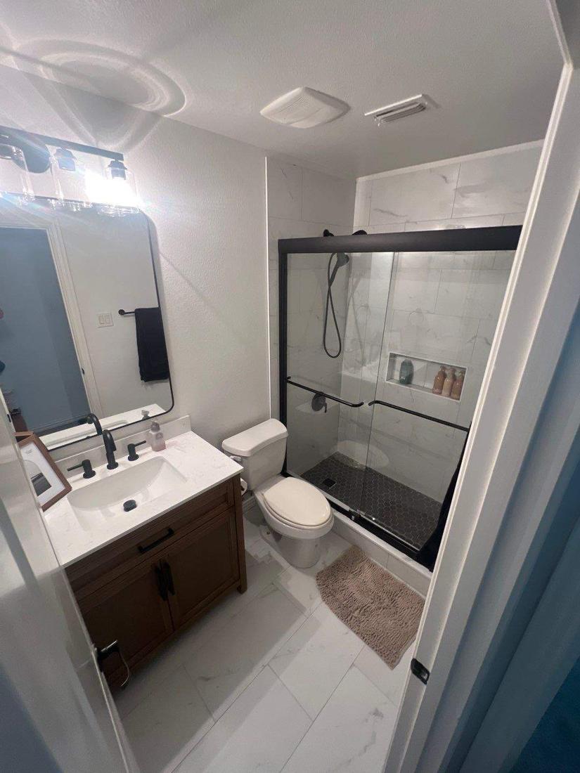 Hall bath with tiled walk-in shower