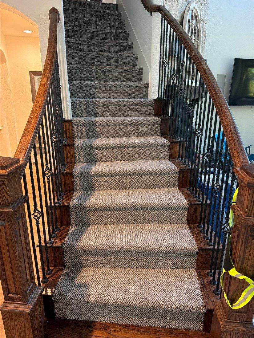 Stair runner on stained oak treads